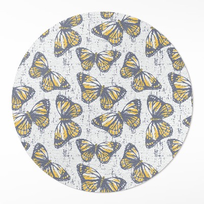 Kulatý vinylový koberec Žlutí motýli na textuře