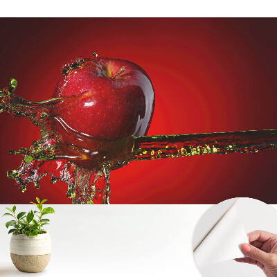 Tapeta s motivem dynamického červeného jablka v tekutém střikanci