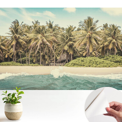 Tapeta do obývacího pokoje s motivem tropického ráje plného palm a modré oblohy