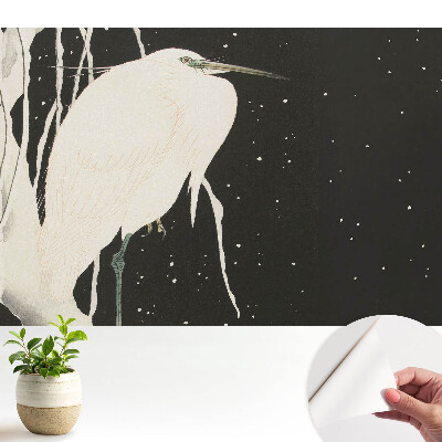 Tapeta s motivem ptáka na větvi během zimního večera