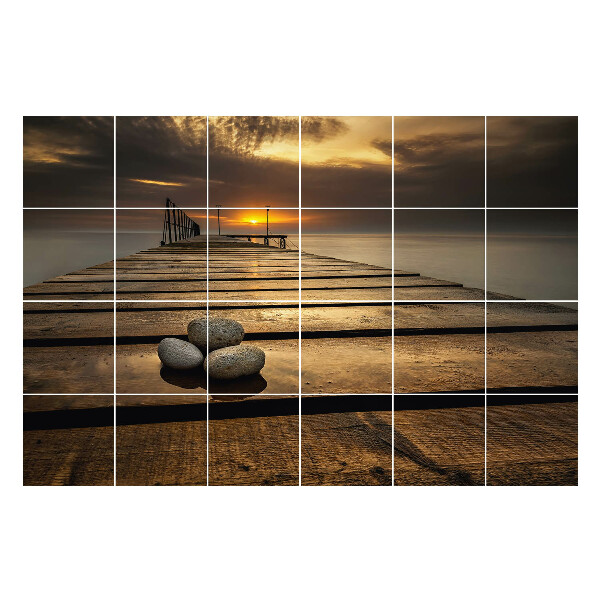 Samolepka na dlaždice Molo nad vodou při západu slunce