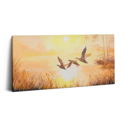 Obraz na plátně 100x50 cm Jeřábi při západu slunce