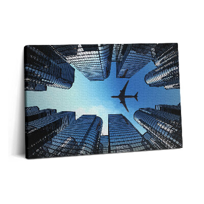 Obraz canvas 60x40 cm Letadlo nad budovami