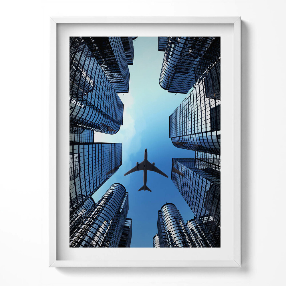 Obraz v rámu Letadlo nad budovami