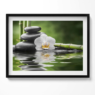 Obraz s rámem Zen - bambusové kameny a květina na vodě