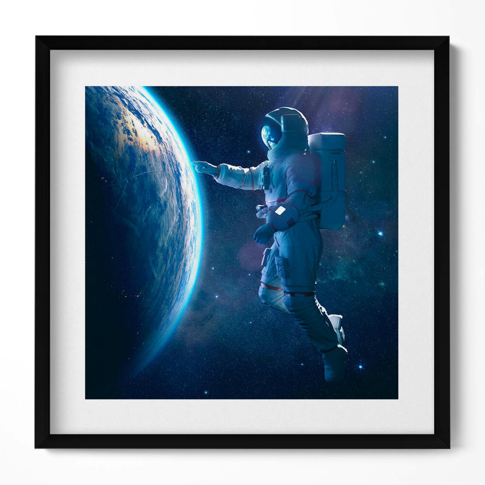Obraz v rámu efektivní Kosmonaut a planeta Země
