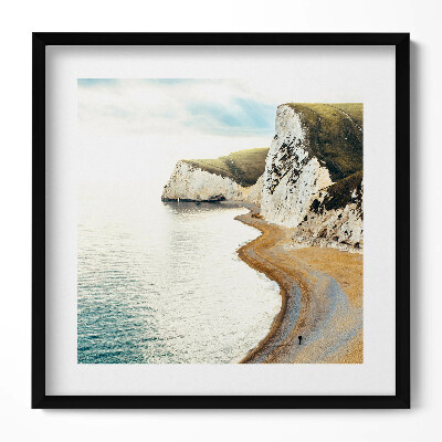 Obraz v rámu efektivní Klidná pláž na úpatí útesů