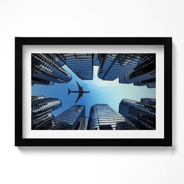 Obraz s rámem dekorativní Letadlo nad budovami