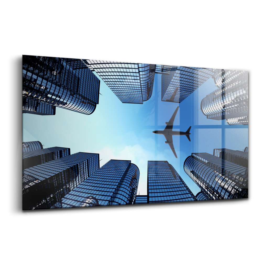 Luxusní skleněný obraz Letadlo nad budovami